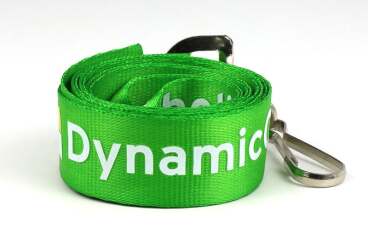 A coiled green lanyard with a metal clip lies on a white background.