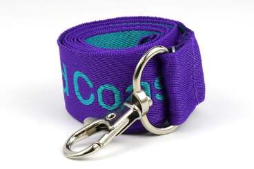 Rolled purple lanyard with a metal clip.
