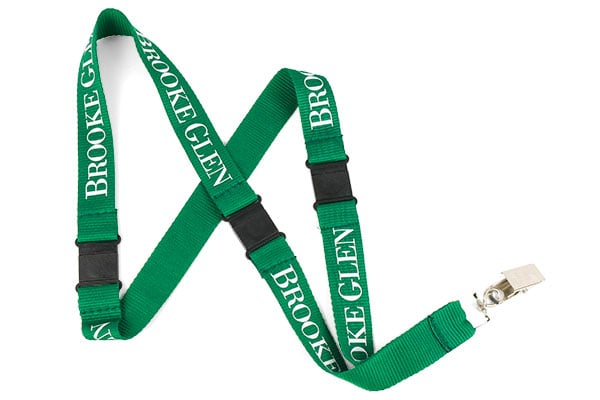 Green polyester lanyard with white text, bulldog clip attachment and 3 safety breaks